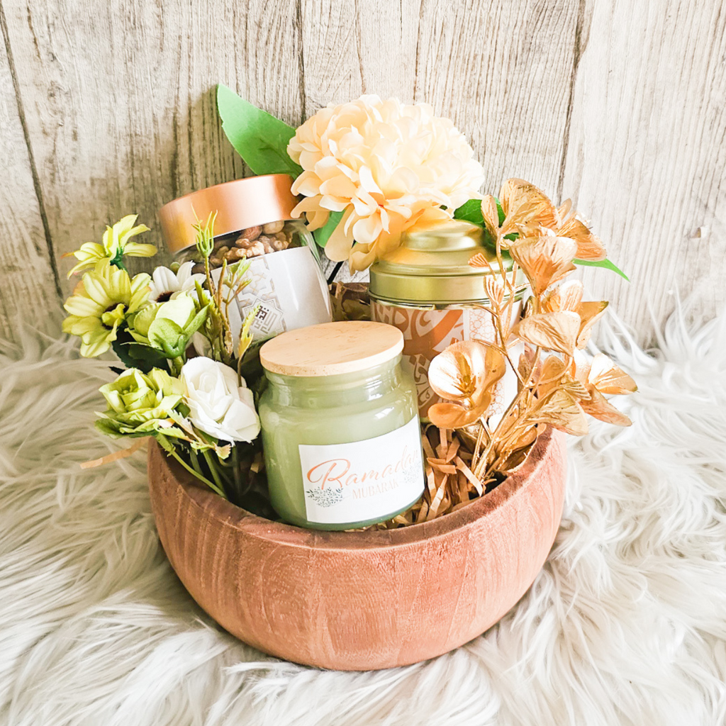 Bright Ramadan (Small) gift basket featuring Rifai mixed nuts, scented candle, Ramadan-themed tea, and decorative flowers.