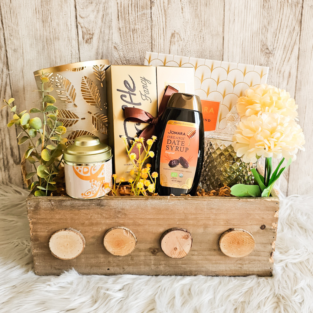 Date & Gold Crate featuring gourmet dates, chocolate truffles, and a stylish candle holder.