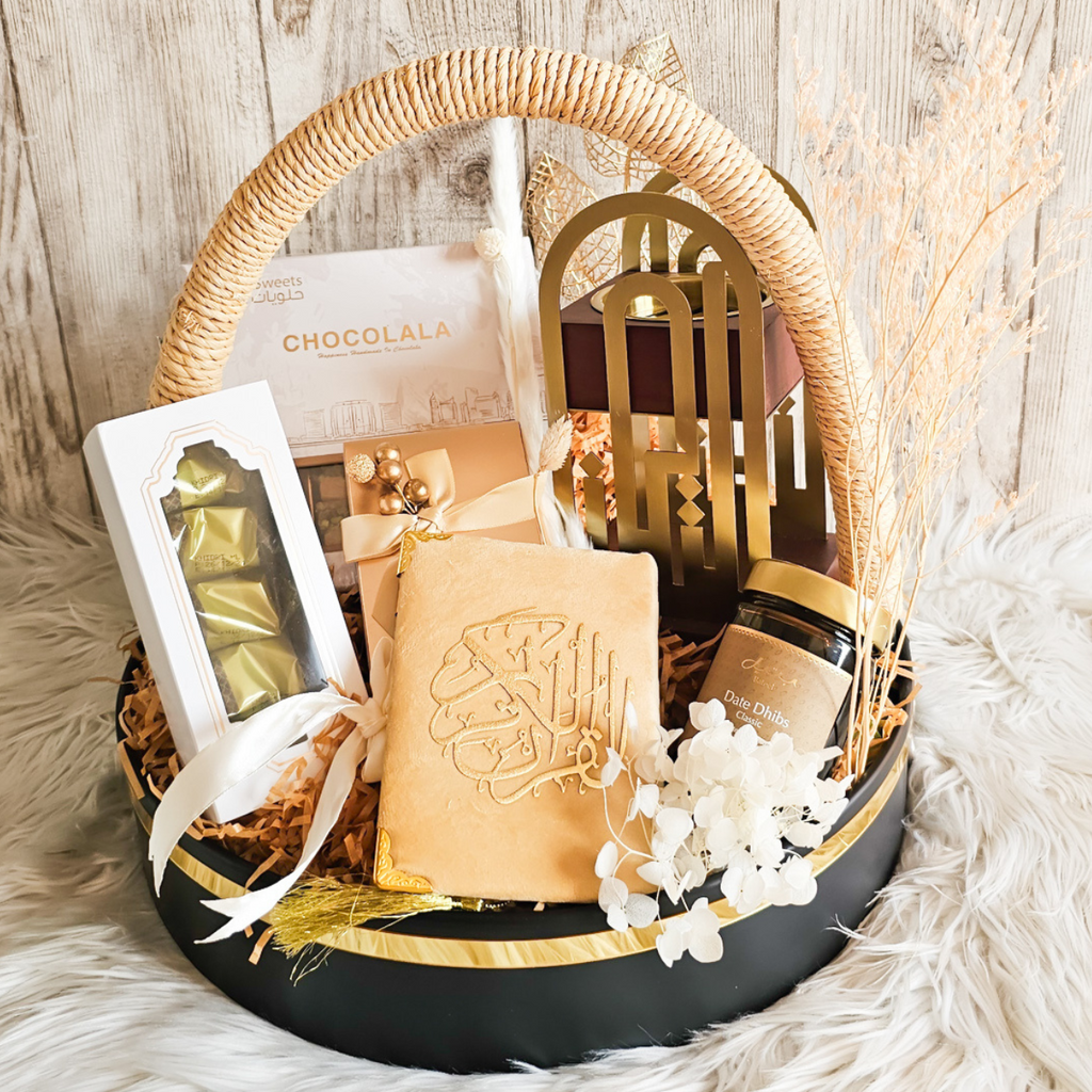 Luxurious Sands of Serenity Hamper beautifully packaged with a velvet Quran, bakhoor stand, and delightful date treats.