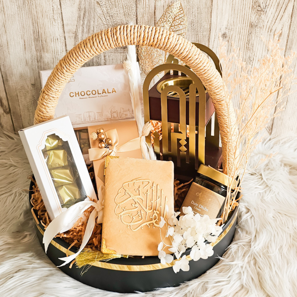 Sands of Serenity Premium Hamper featuring assorted baklawa, Bateel dates, a Quran, and elegant decorations for Ramadan and Eid