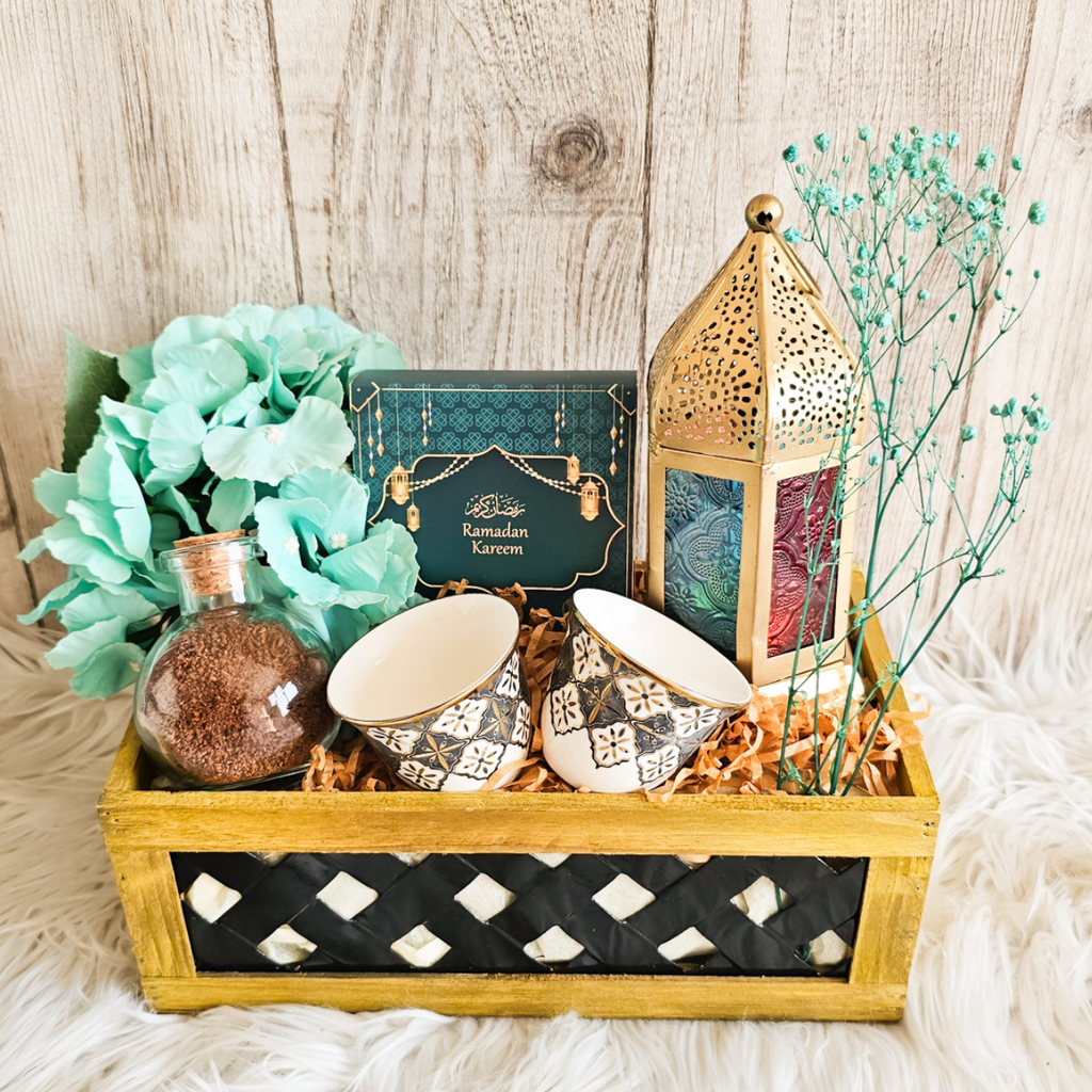 Illuminating Basket featuring an Arabian lantern, kahawa cups, and Ramadan Kareem chocolate box - a perfect Ramadan gift basket.